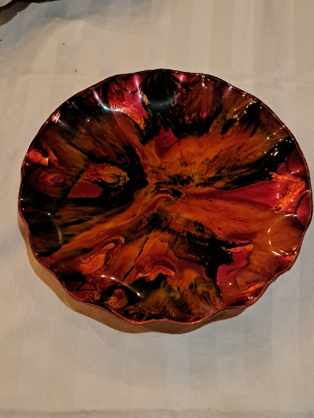 Vintage Seetusee Canadian art glass ruffled bowl featuring a red and black abstr